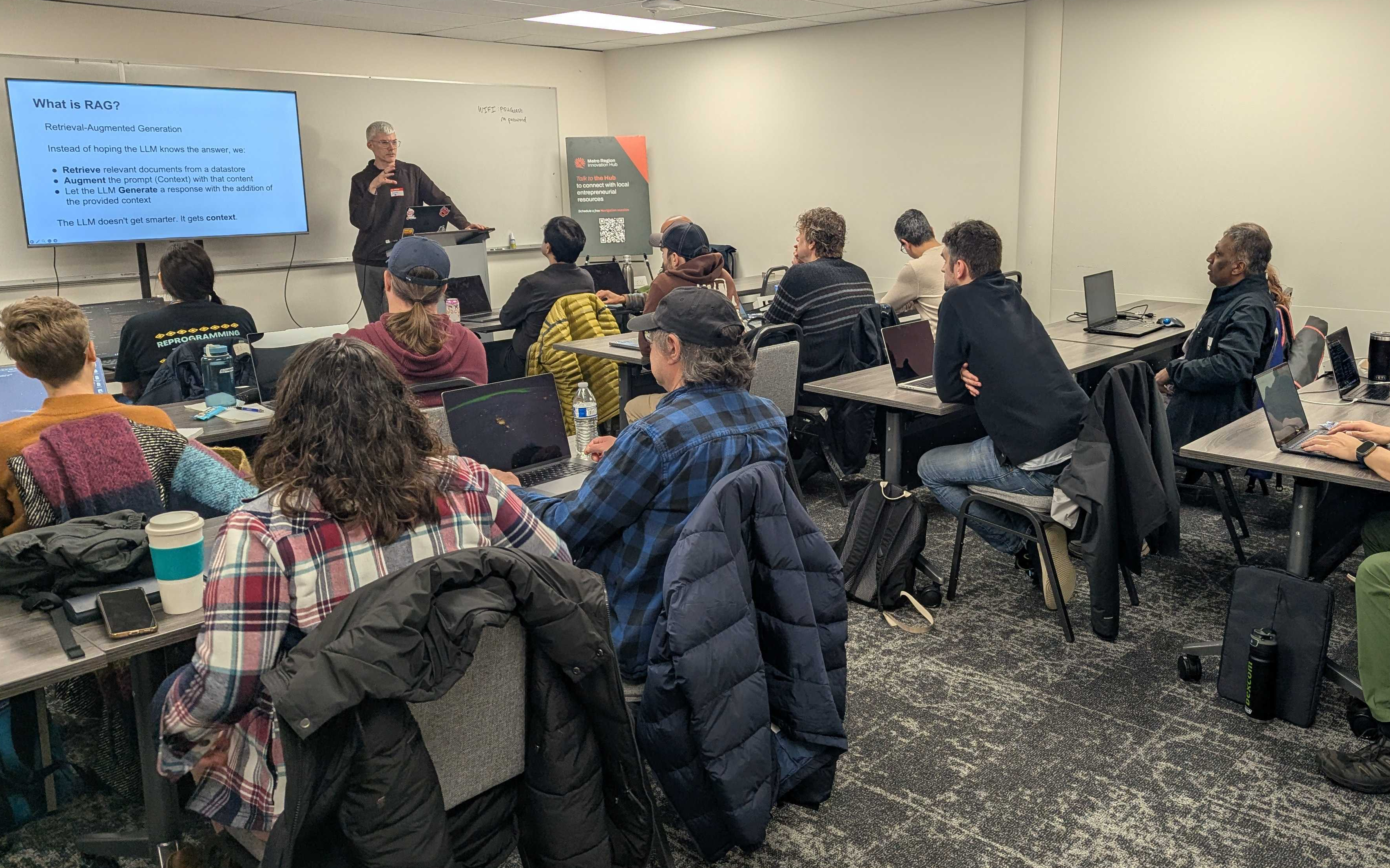 Sam Keen teaching a RAG workshop to a room of developers
